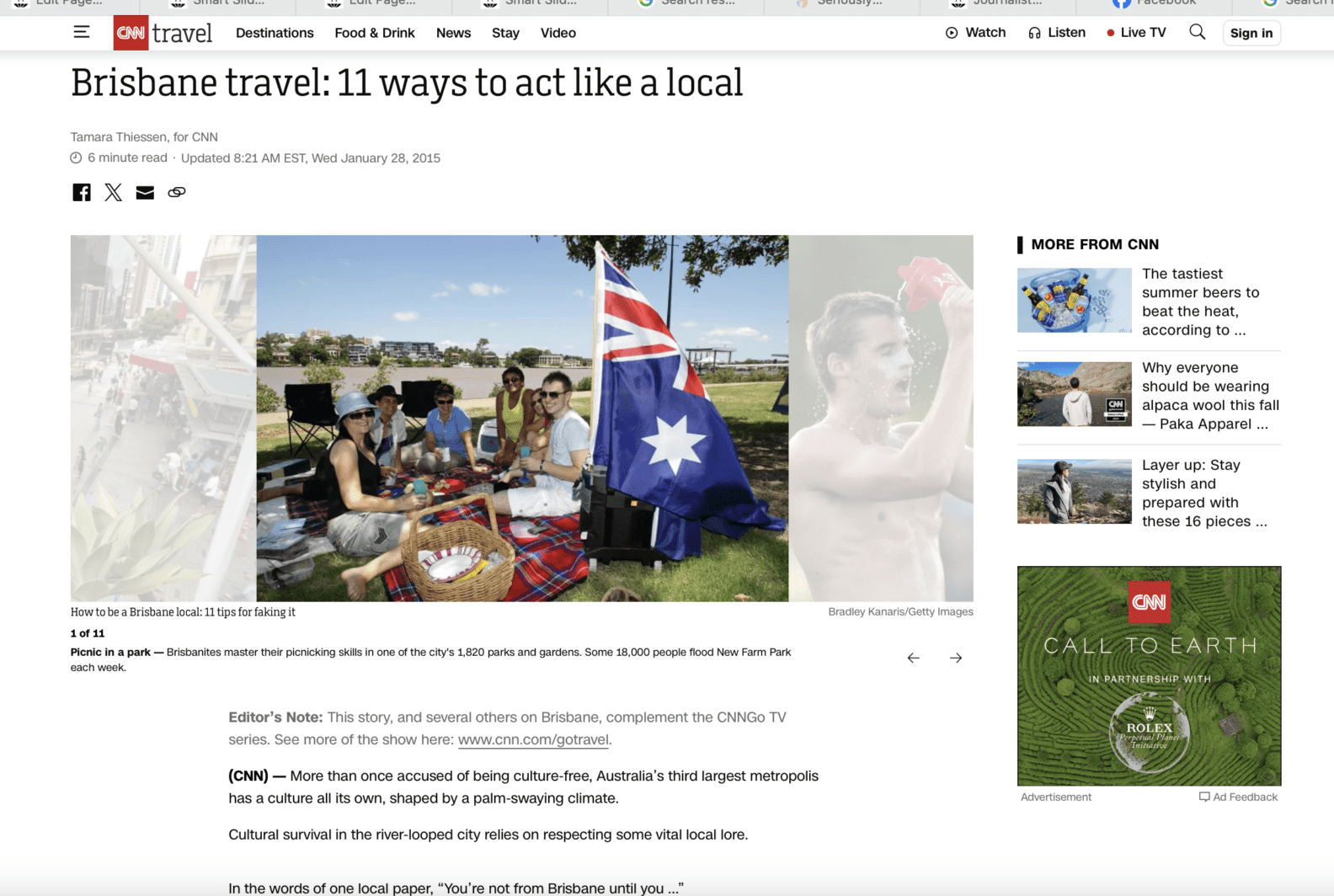 Brisbane travel story by Tamara Thiessen for CNN with people having a picnic by the river with Australian flag